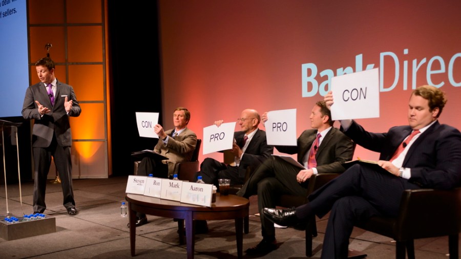 Yup, that's me moderating a point-counterpoint session on bank M&A